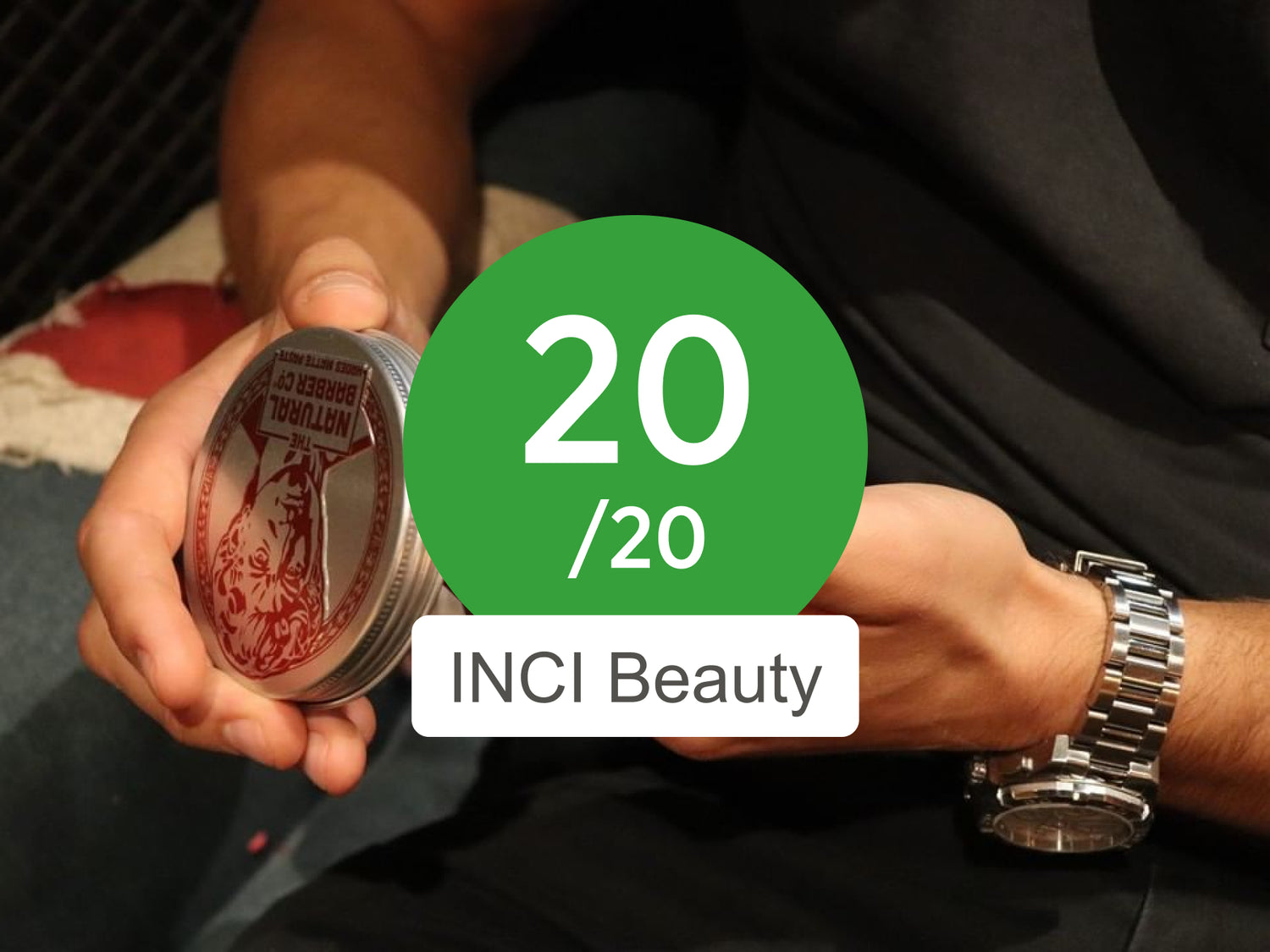 20 out of 20 on INCI Beauty man holding tin of hair wax with score overlayed